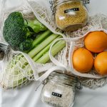 Assortment of zero waste products including reusable bags, jars, and bottles