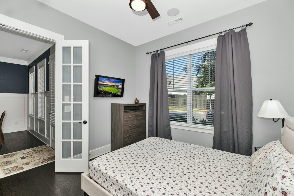 Minimalist bedroom with neutral colors and ample natural light