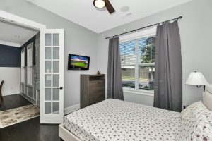 Minimalist bedroom with neutral colors and ample natural light