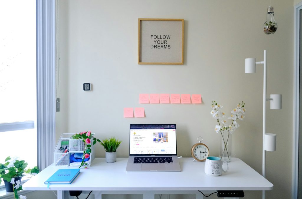 Minimalist office with white desk and chair